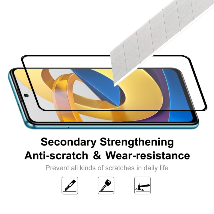 Tempered glass screen protector film being applied to a smartphone screen