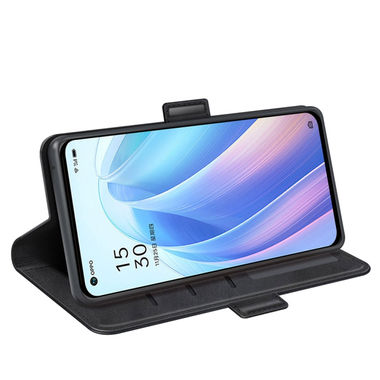Black leather flip phone case in stand position for viewing, with strap and cutout