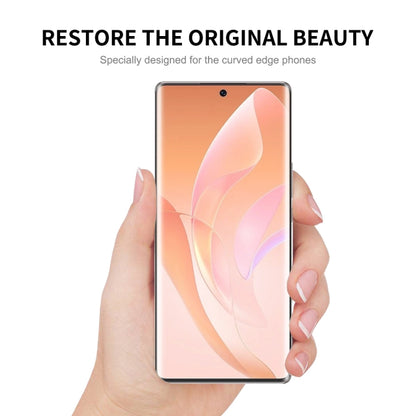 Curved edge screen protector being held for installation on a smartphone