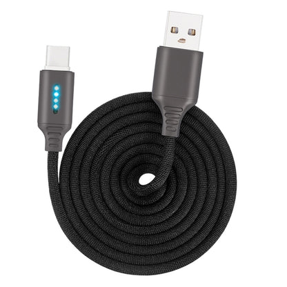 Black braided USB charging cable with metal connector ends and blue status indicator