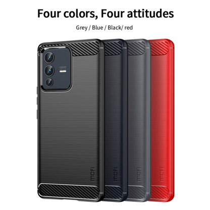Set of four phone cases in gray, blue, black, and red with carbon-fiber accents