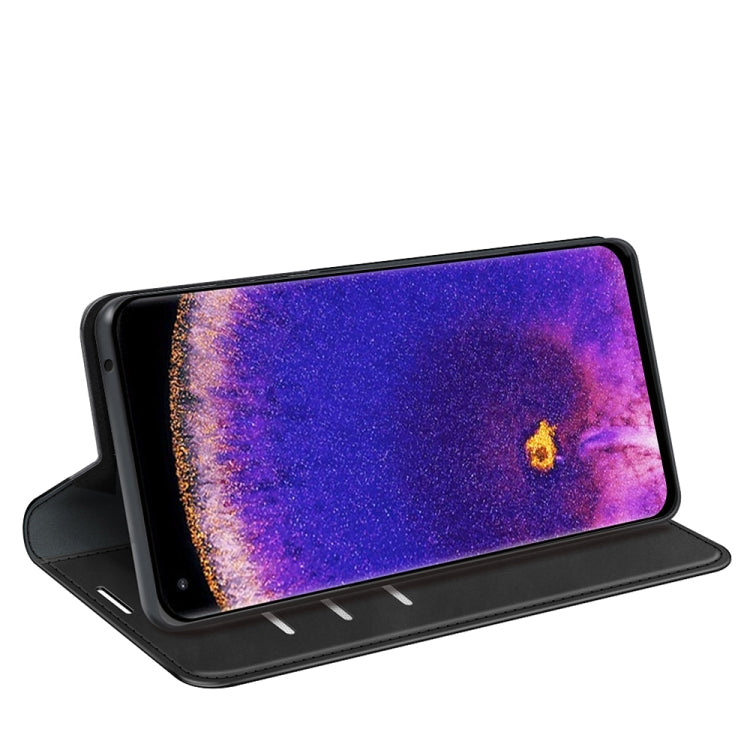 Black leather flip phone case used as a horizontal stand with open cover.