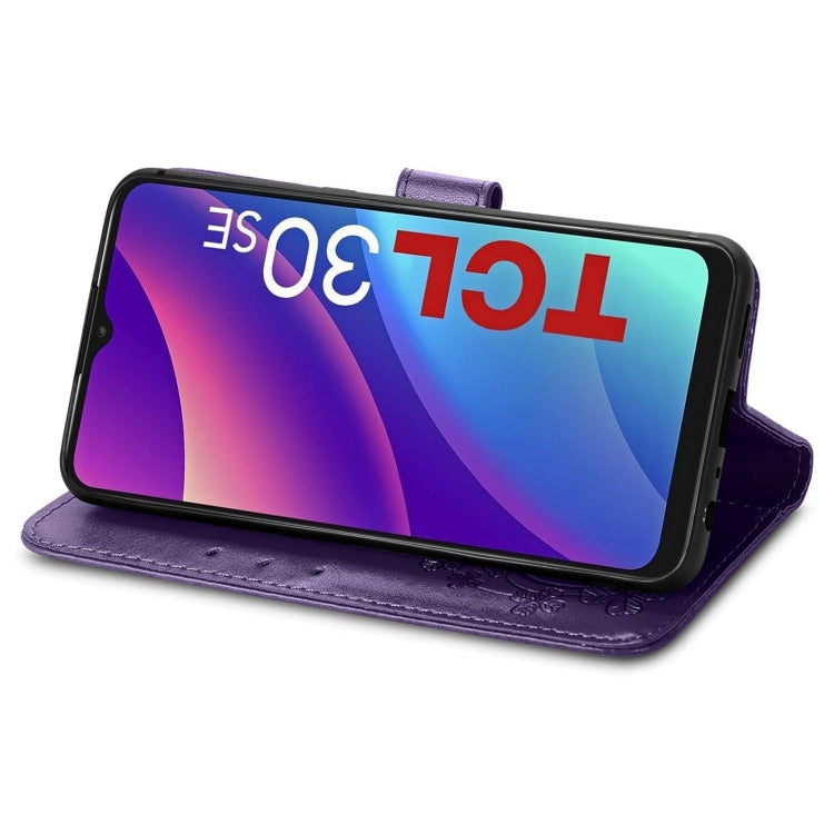 Purple leather wallet phone case with embossed pattern, four-leaf clasp, horizontal stand view