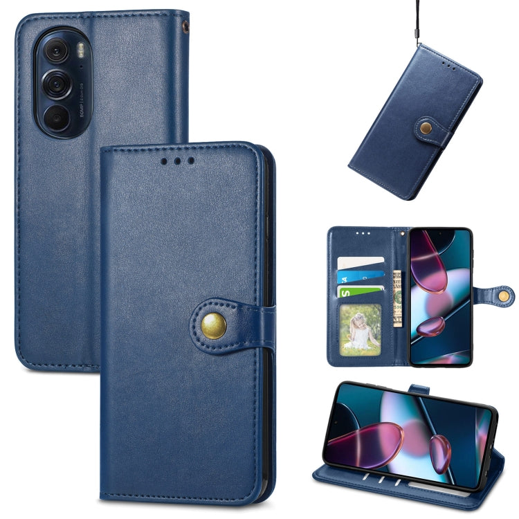 Blue leather flip phone case with gold buckle, card slot, and viewing stand