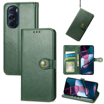 Green leather flip phone case with gold buckle, card holder, and stand