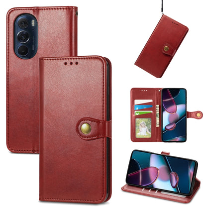 Red leather flip phone case with gold buckle, card slot, and viewing stand