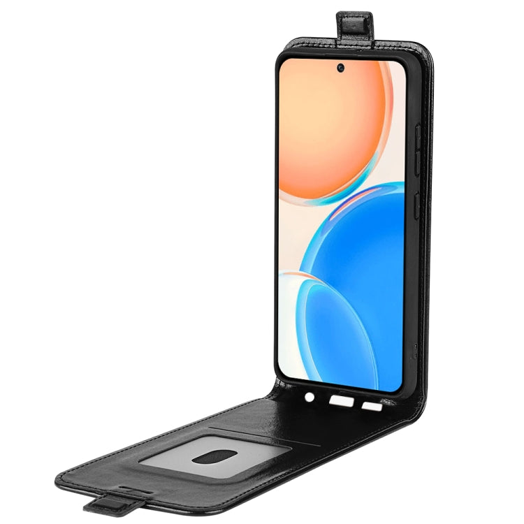 Black leather flip phone case open, showing inner card slot and front screen cover