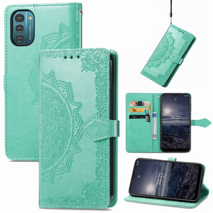 Mint green embossed mandala flip leather phone case with magnetic strap and card slots