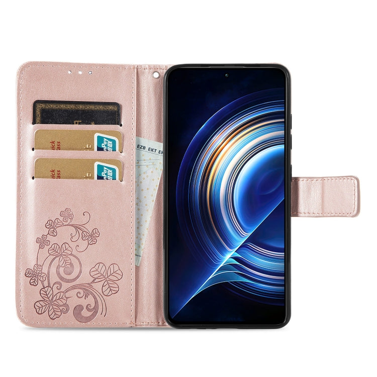 Rose pink embossed leather wallet phone case open view, floral pattern and clasp strap