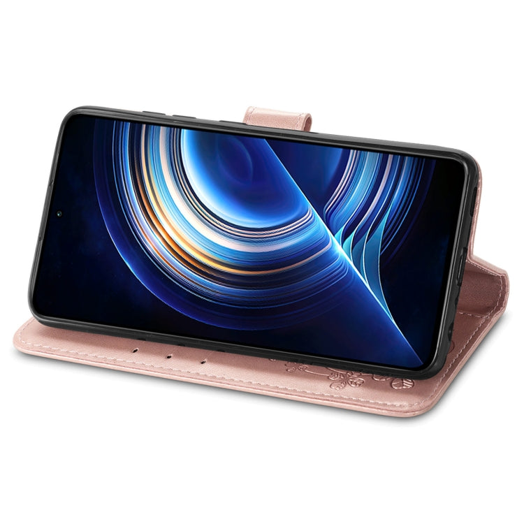 Rose pink embossed leather wallet phone case with clasp buckle, phone propped for viewing