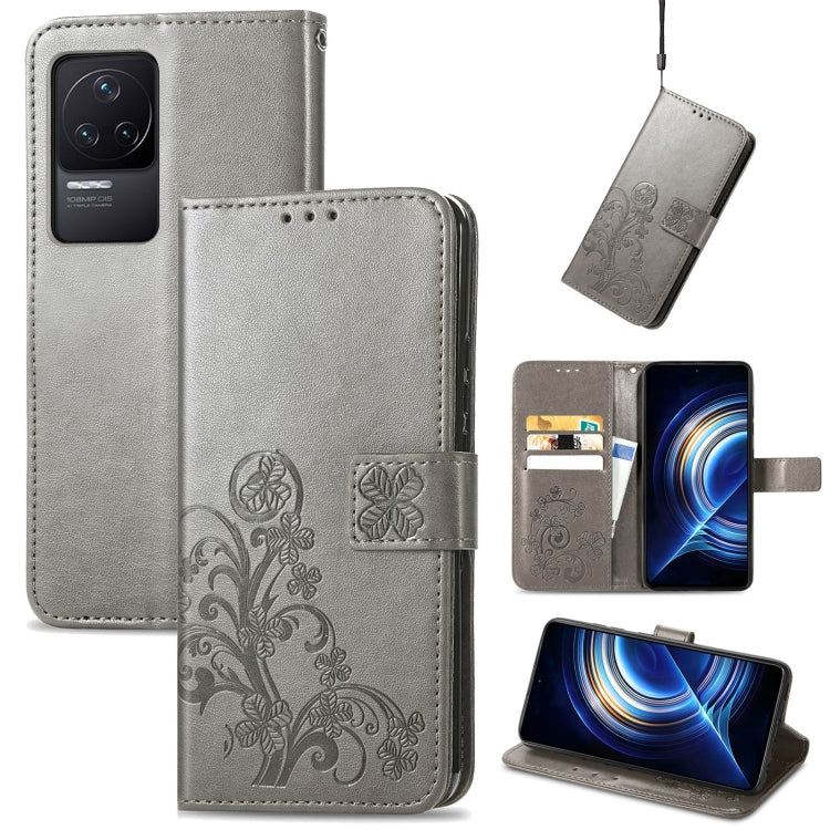 Gray leather folio phone case with embossed floral pattern, clasp buckle and card slots