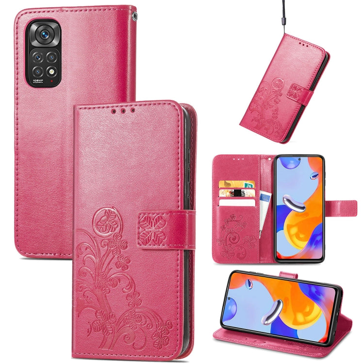 Pink leather folio phone case with embossed floral pattern, clasp buckle and card slots