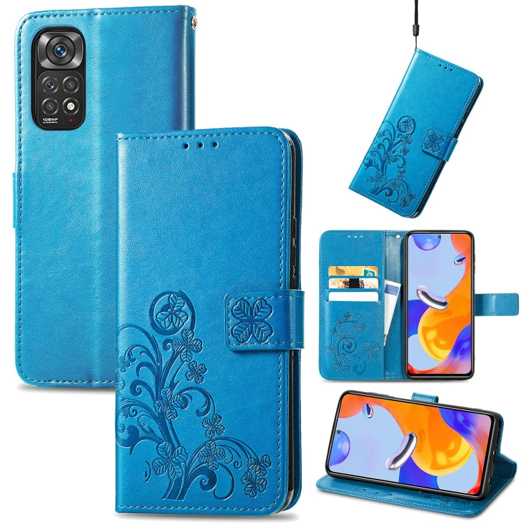 Blue leather folio phone case with embossed floral pattern, clasp buckle and card slots