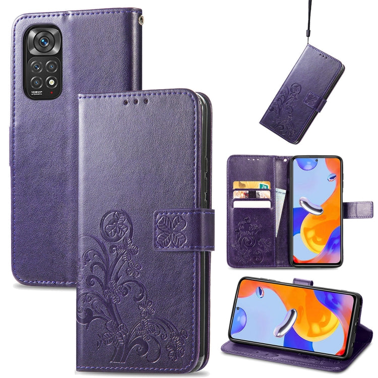 Purple leather folio phone case with embossed floral pattern, clasp buckle and card slots