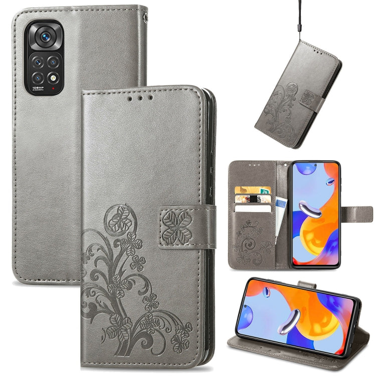 Gray leather folio phone case with embossed floral pattern, clasp buckle and card slots