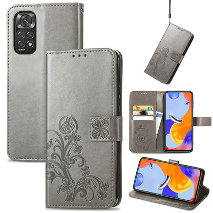 Gray leather folio phone case with embossed floral pattern, clasp buckle and card slots