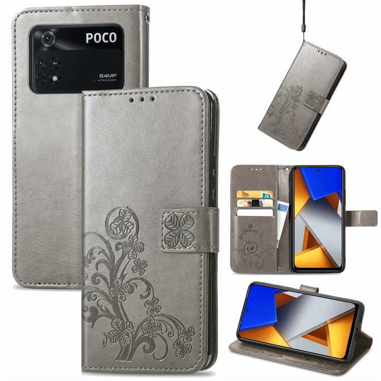 Gray embossed leather phone case with four-leaf clasp buckle, card slots and stand