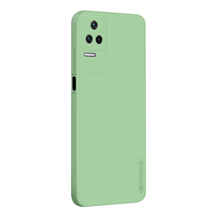 Green phone case with triple camera cutout and side button openings, smooth TPU fit