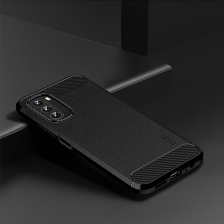 Dark TPU phone case with brushed finish and carbon-fiber corner accents