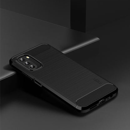 Dark TPU phone case with brushed finish and carbon-fiber corner accents