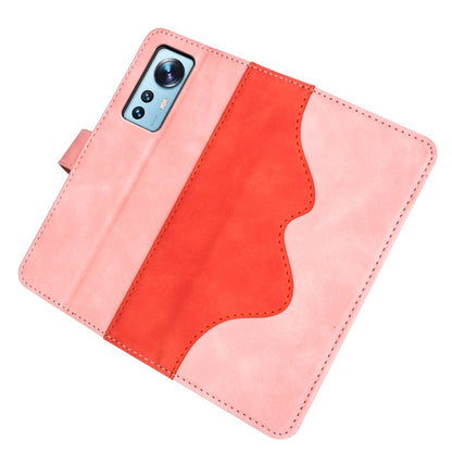 Pink leather flip phone case laid flat with stitched wave panel and flap