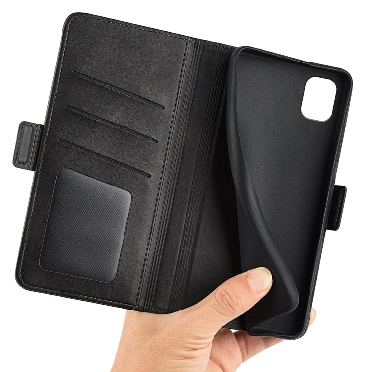 Black leather wallet-style phone case opened with card slots and hand holding