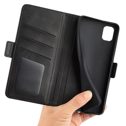 Black leather wallet-style phone case opened with card slots and hand holding