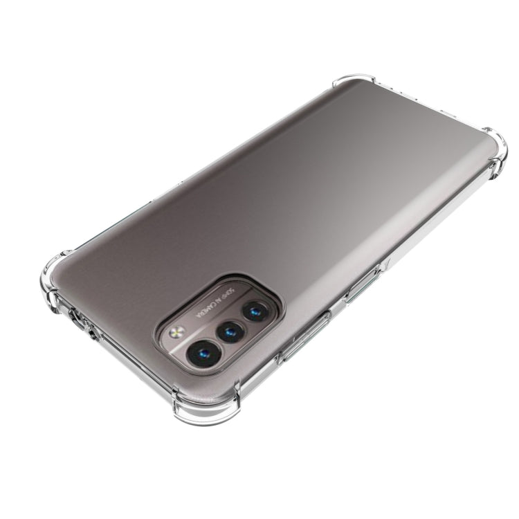 Clear shockproof TPU case for Nokia G21/G11 on gray phone, raised camera and edges