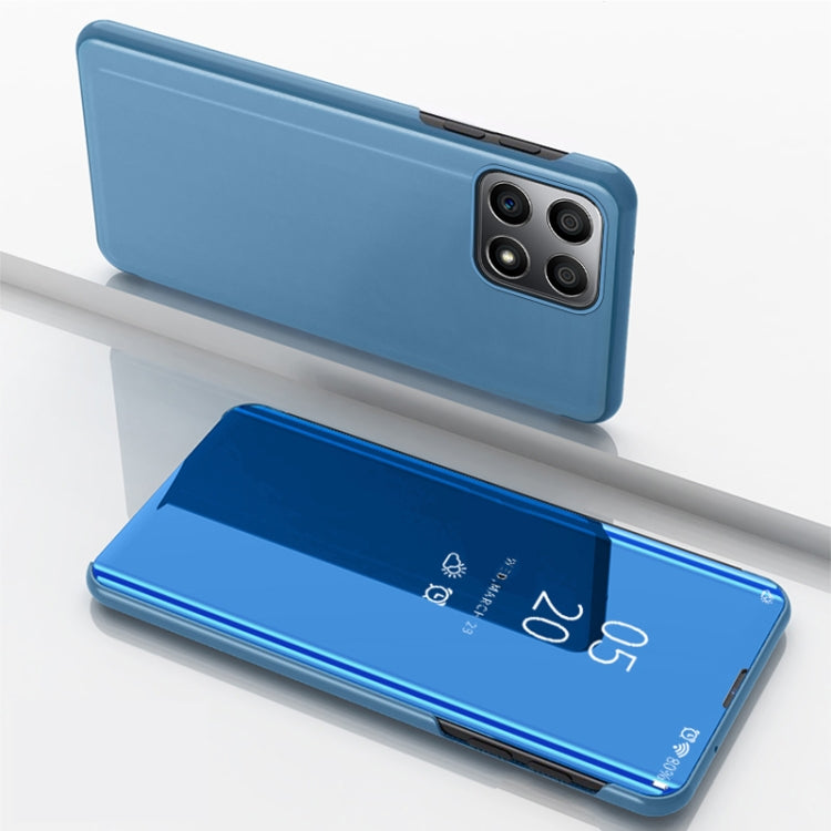 Blue horizontal flip leather phone case with mirrored front and quad camera cutouts
