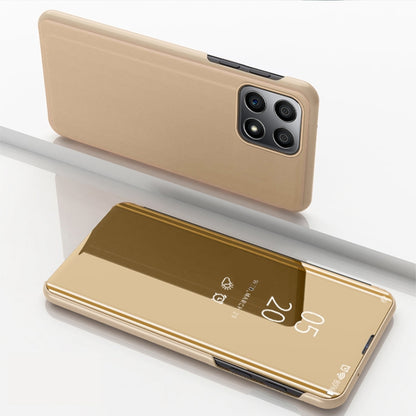 Gold horizontal flip leather phone case with mirrored front and quad camera cutouts