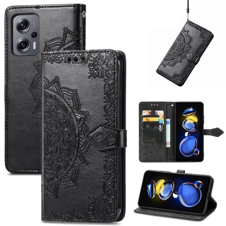 Black embossed mandala flip leather phone case with magnetic strap.
