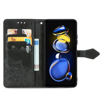 Black embossed mandala flip leather phone case open with card slots.
