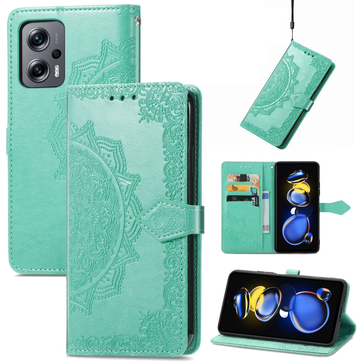 Mint green embossed mandala flip leather phone case with magnetic strap.