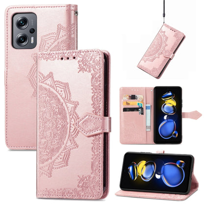 Rose pink embossed mandala flip leather phone case with magnetic strap.