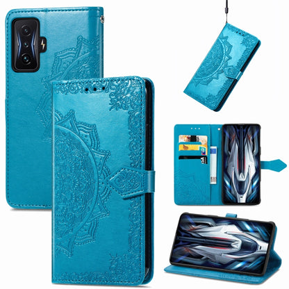 Blue embossed mandala flip leather phone case with card holder and strap.