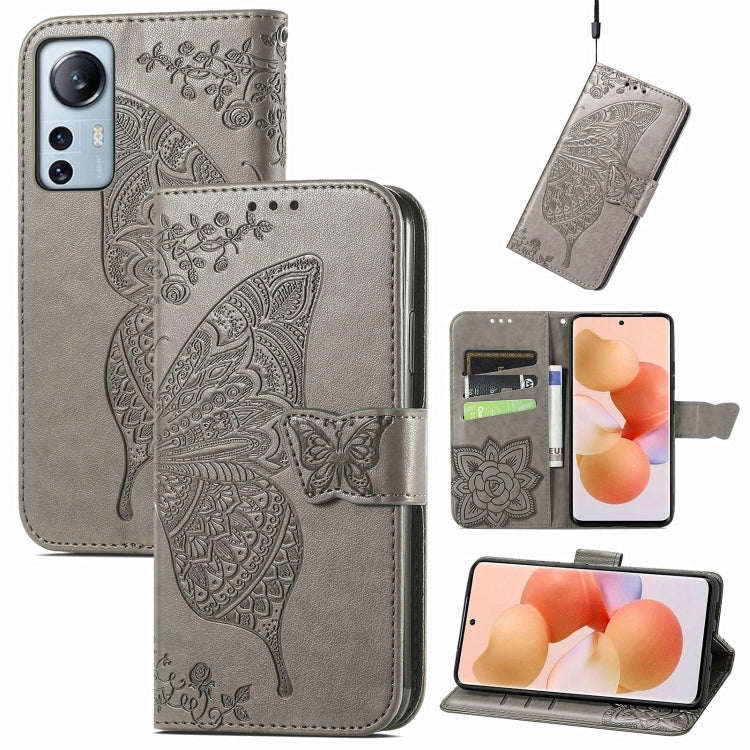 Light gray embossed butterfly flip phone case with card slots and magnetic strap.