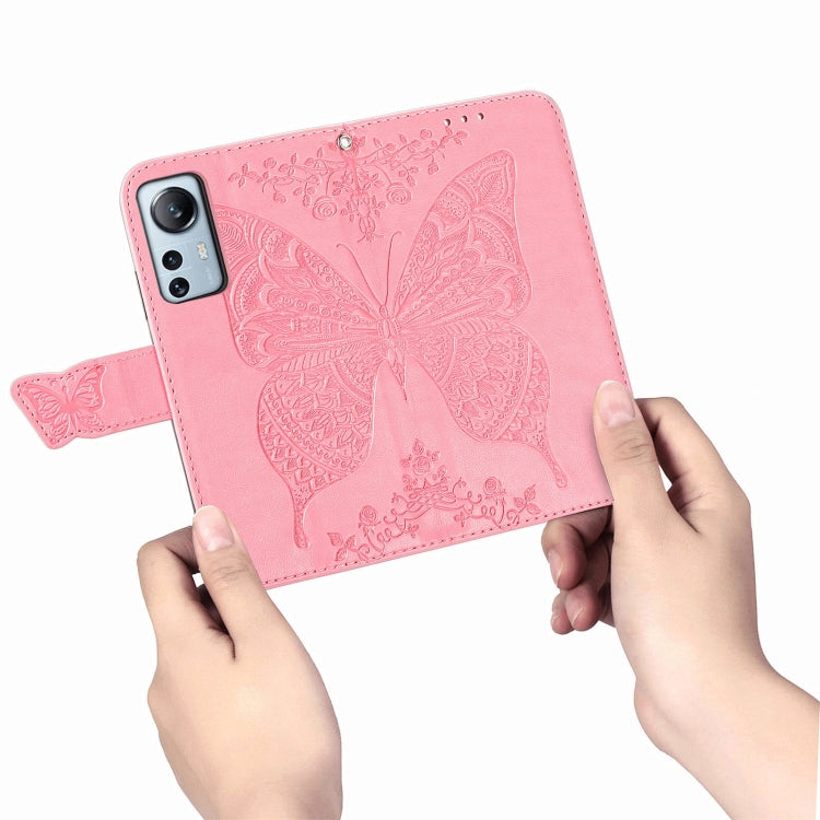 Pink embossed butterfly flip leather wallet phone case with hand holding front cover