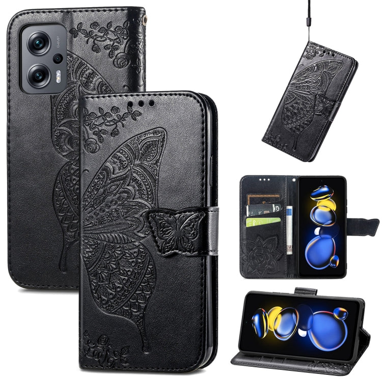 Black embossed leather flip phone case with butterfly flower design and hands-free stand