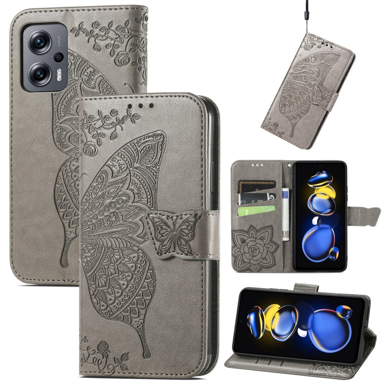 Gray embossed butterfly flip phone case with card slots and folio front.