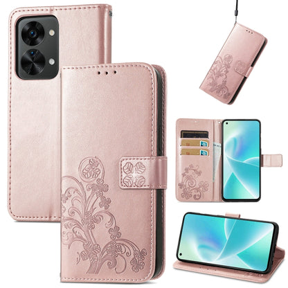Blush pink leather phone case with embossed floral pattern, buckle clasp, and card slots
