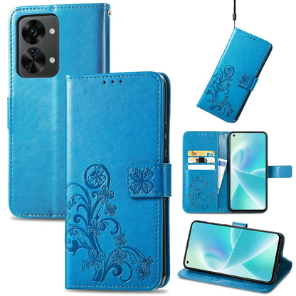 Blue leather wallet phone case with embossed floral pattern, buckle closure, and card slots