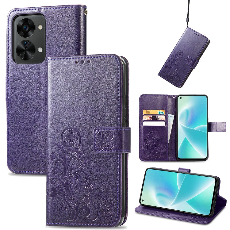 Purple leather wallet phone case with embossed floral pattern, buckle closure, and card slots