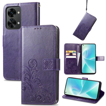 Purple leather wallet phone case with embossed floral pattern, buckle closure, and card slots