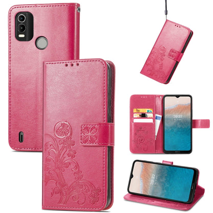 Rose red leather folio phone case with embossed floral pattern, buckle clasp, card slots