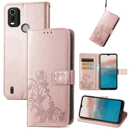 Blush pink leather folio phone case with embossed floral pattern, buckle clasp, card slots