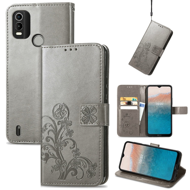 Gray leather phone case with embossed floral buckle clasp, flip cover and stand