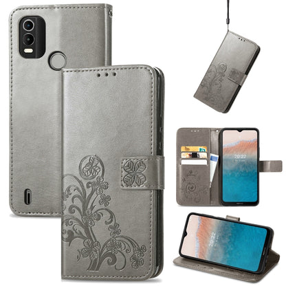 Gray leather phone case with embossed floral buckle clasp, flip cover and stand