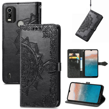 Black embossed leather flip phone case with mandala design, card slots, and stand cover