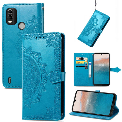 Blue embossed leather mandala flip phone case with card slots and folio stand cover
