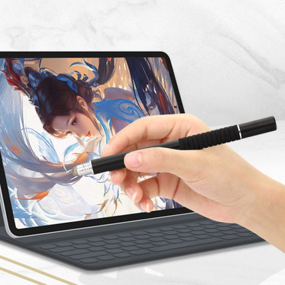 Black capacitive stylus pen with silver disc tip, used on a tablet screen